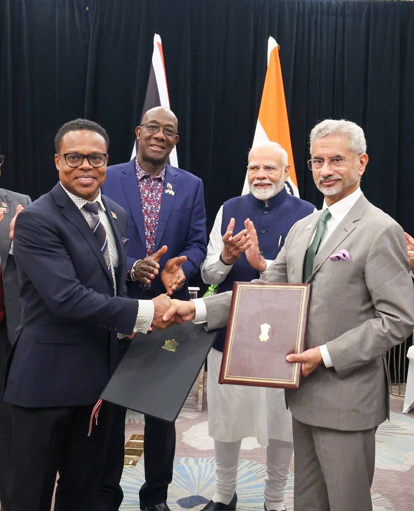 SHAKE ON IT: Foreign and Caricom Affairs Minister Dr Amery Browne shakes hands with India's External Affairs Minister Dr Subrahmanyam Jaishankar after the signing of an MoU on agro-processing initiatives at the Caricom-India Summit in Guyana. Looking on are Prime Minister Dr Keith Rowley and India's PM Narendra Modi, 2nd from right. PHOTO COURTESY THE FOREIGN AND CARICOM AFFAIRS MINISTRY - 