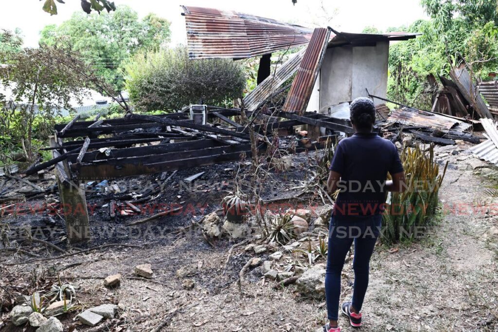 The burnt ruins of the home of pensioner Kenneth “Hawkeye” Lewis, 75, of Blitz Village, Pleasantville, San Fernando. Lewis, who lived alone, died in the house fire early on November 23.  - Photo by Lincoln Holder 