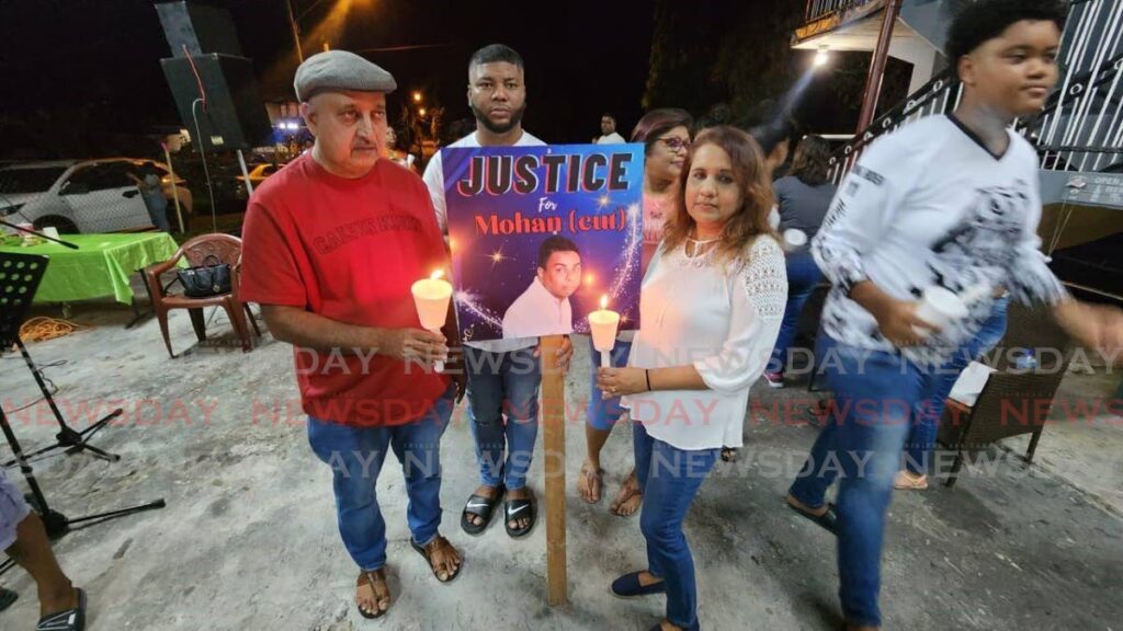 Linley Parahoo, left, and Margaret Girdyharrysingh, are calling on the police to solve Mohan's murder. - Photo by Yvonne Webb 