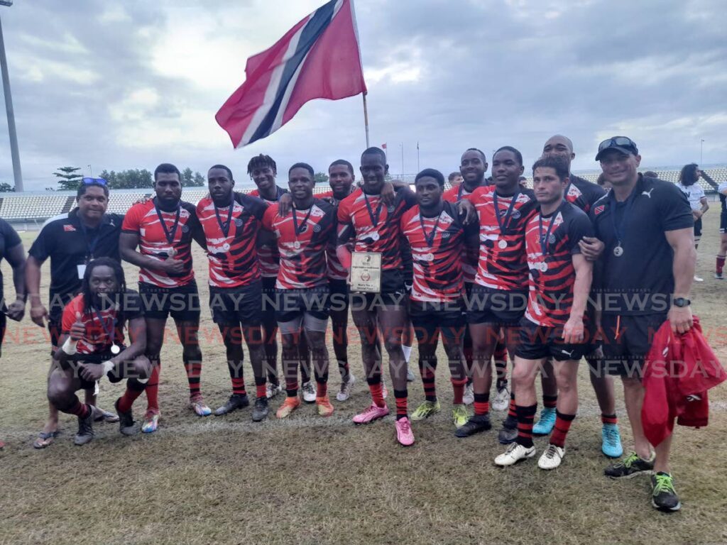 TT rugby men's players and staff celebrate after finishing second in the 2024 Rugby Americas North tournament at the Larry Gomes Stadium in Arima on November 24. PHOTO BY RONEIL WALCOTT - Roneil Walcott