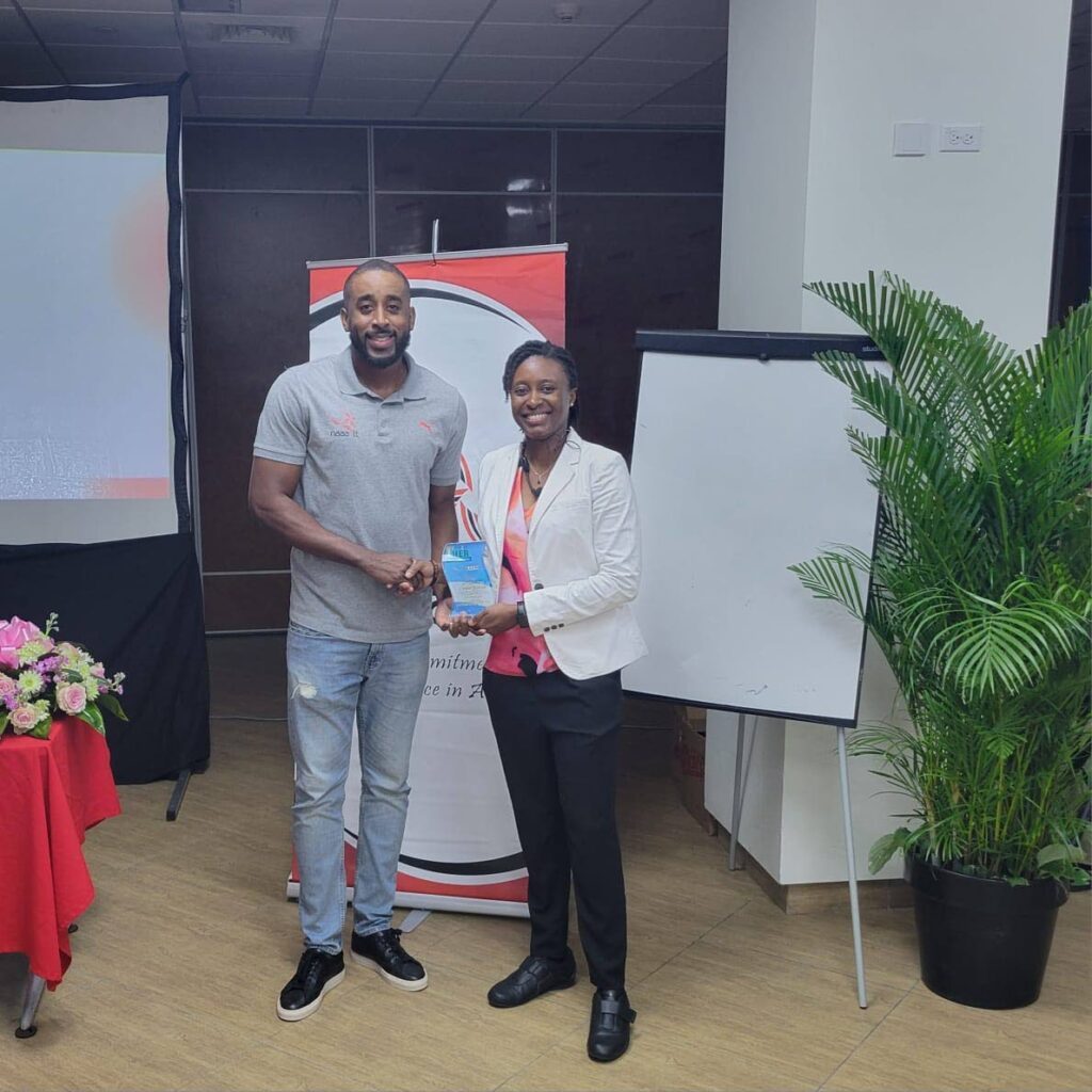 TT's 2013 World Athletics Champs men's 400m hurdles winner Jehue Gordon, left, and 2009 World Athletics Champs women's 400m hurdles bronze medalist Josanne Lucas at the NAAATT's women's workshop-seminar on November 23. - Photo courtesy NAAATT