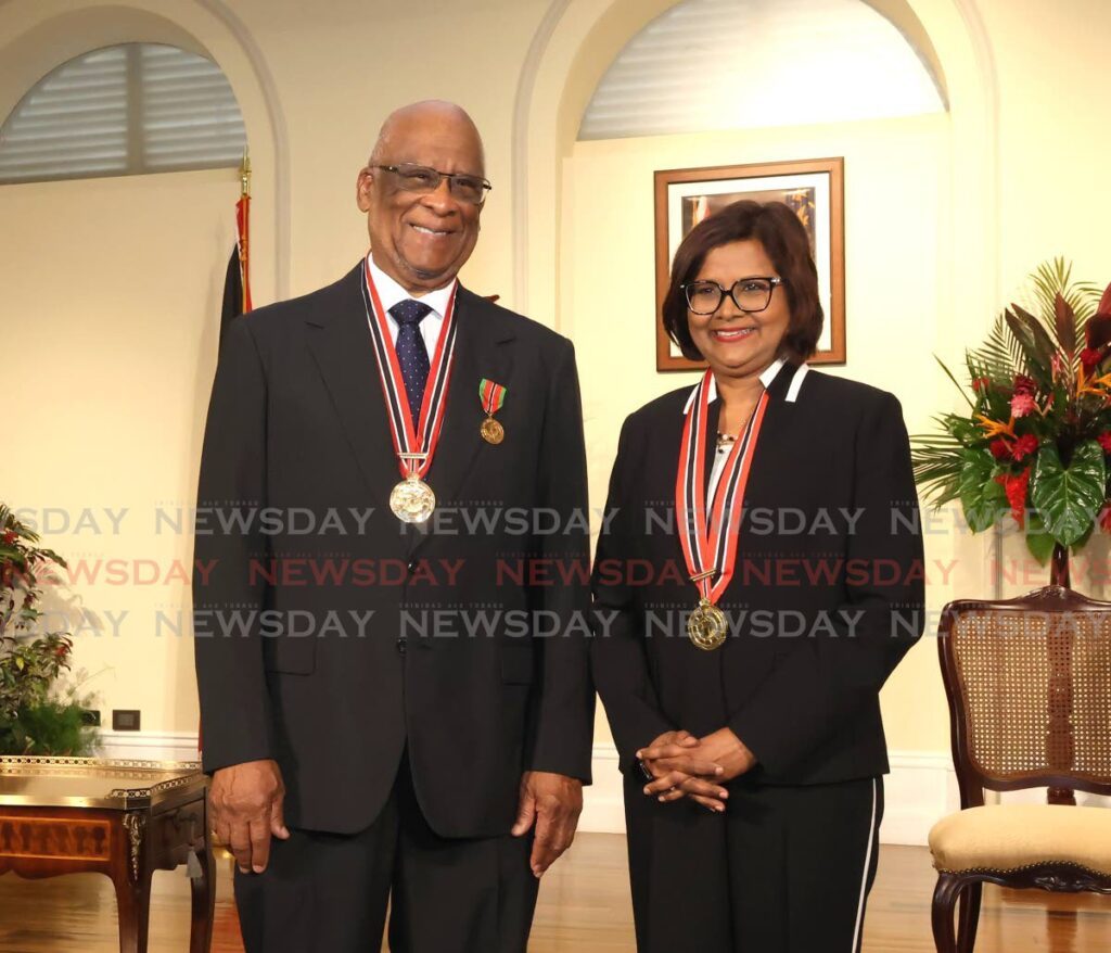 Russell Martineau, SC, stands with President Christine Carla Kangaloo after receiving the Order of the Republic of Trinidad and Tobago (ORTT) at a ceremony at the President's House, St Ann's, Port of Spain on November 26.
Martineau is one of three awardees who were unable to attend the National Awards ceremony on September 24.  - Photo by Faith Ayoung