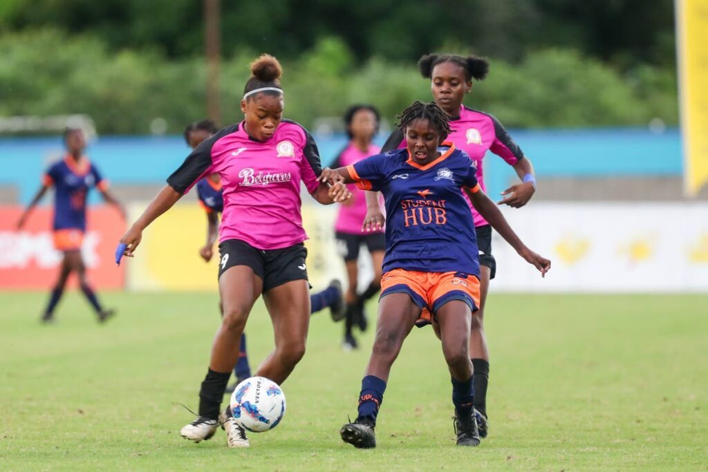 Pleasantville Secondary Nikita Gosine (L) vies for possession with Five Rivers Secondary's Hackeema Goodridge during the SSFL Girls Big 5 final at the Ato Boldon Stadium on November 26,in Balmain - Daniel Prentice