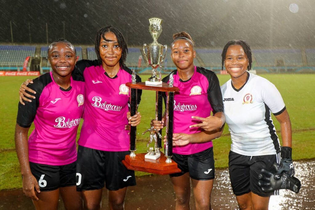 (L-R) Pleasantville Secondary School's Natalia Gosine, Tayeann Wylie, Nikita Gosine and goalkeeper Janike Ramoutar with the winners trophy after defeating Five Rivers Secondary in the SSFL Girls Big 5 final at the Ato Boldon Stadium on November 26, 2024 in Balmain, Couva. - Daniel Prentice