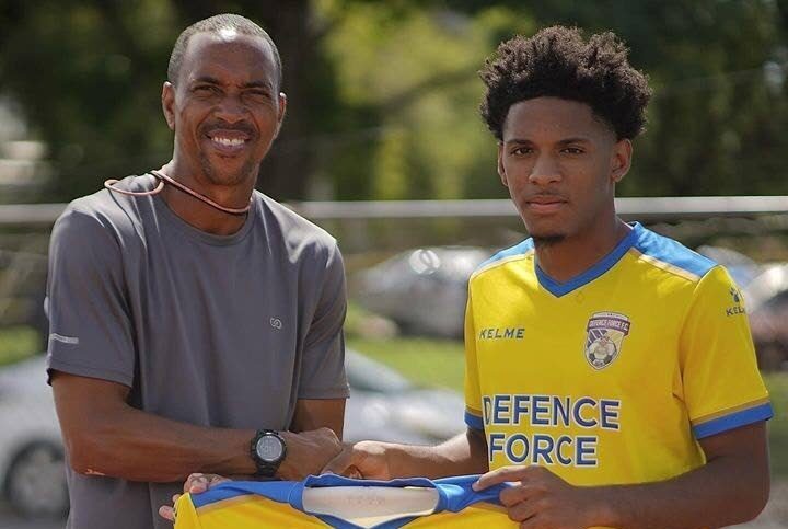 Defence Force coach Densill Theobald, left, and new signing Christian Bailey. - Photo courtesy Defence Force's Instagram account