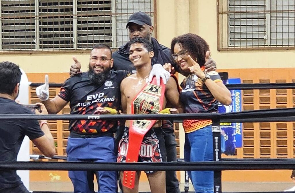 Kickboxing champion Shiva Toolsie, middle front, alongside his coaches Jason Ramoutar, from left, Marc Phillip and Keele Lawrence-Chan. -