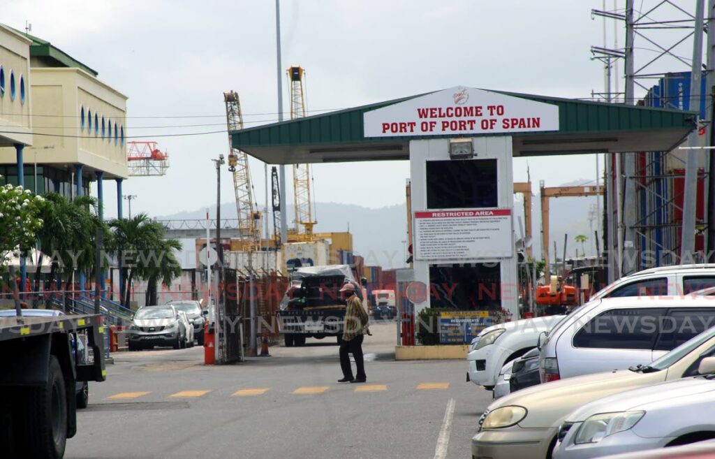 A man walks past the entrance to the  Port of Port of Spain. - File photo