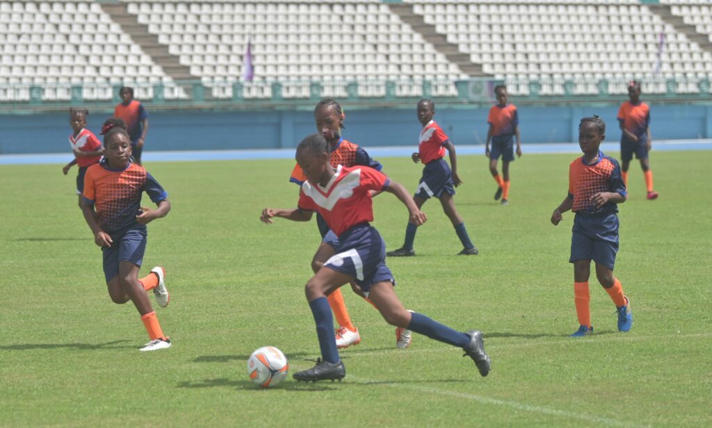 A Scarborough RC player on the ball against Signal Hill Primary School in the final of the Tobago Primary Schools Football League at the Dwight Yorke Stadium, Bacolet, November 1.  - Photo courtesy Visual Styles 