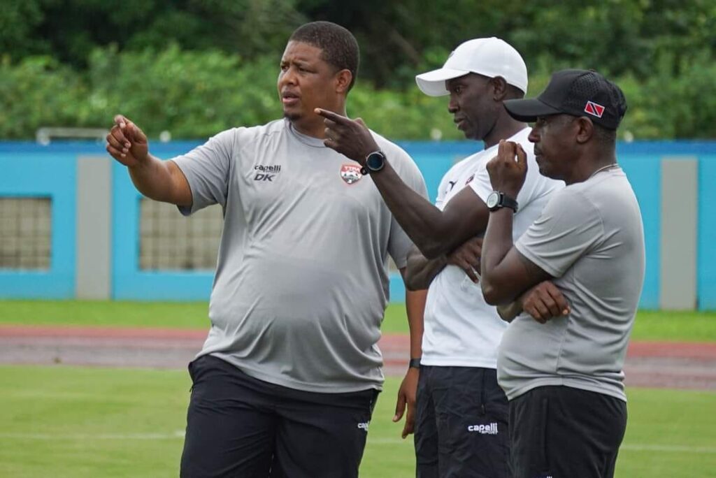 New Soca Warriors head coach Dwight Yorke, centre, during a training session at the Ato Boldon Stadium in Couva on November 12, alongside assistant coaches Russell Latapy, right, and Derek King. - Photo courtesy the TT Football Association's Facebook page