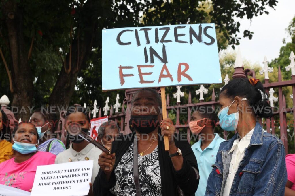 VOX POPULI VOX DEI: Citizens voice their concerns outside the Red House ahead of the national budget reading. FILE PHOTO - 