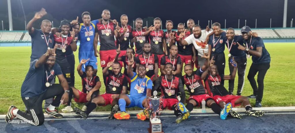 In this October 10, 2023 file photo, 1976 Phoenix FC players and officials celebrate after winning the final of the TT Premier Football League Tier II tournament, against Petit Valley-Diego Martin United, at the Dwight Yorke Stadium, Bacolet.   - 