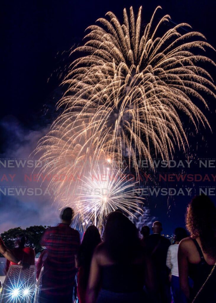 National Insurance Board workers look at fireworks at the Queen's Park Savannah, Port of Spain on August 31. - File photo by Jeff K Mayers