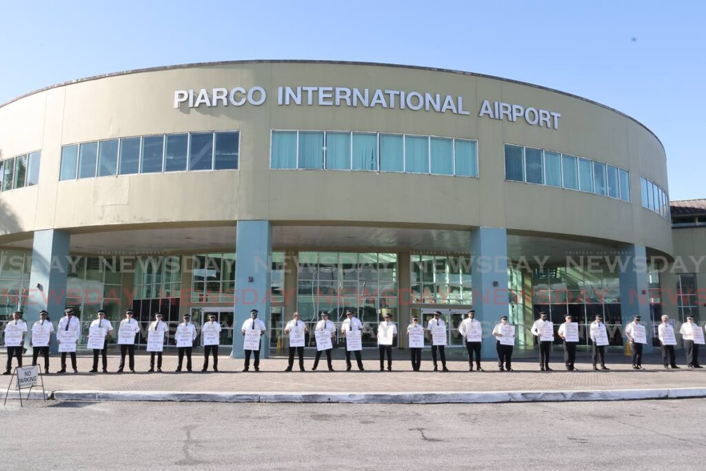 Caribbean Airlines Pilots (CAL) who are members of the Trinidad and Tobago Airline Pilots Association (TTALPA) protest at Piarco International Airport on October 3. FILE PHOTO - 