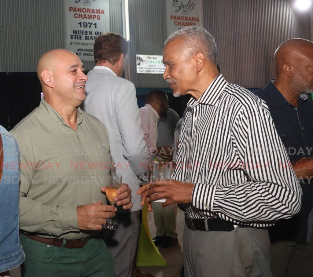 From left, Eugene Tiah, president & CEO of the Caribbean Energy Chamber and Steve Bideshi, managing director of Bespoke Capital greet each other at the Proman Foundation developing skills and building communities event at the Proman Starlift House of Music, Christopher Samuel Drive, Port of Spain on November 13. - Photo by Faith Ayoung