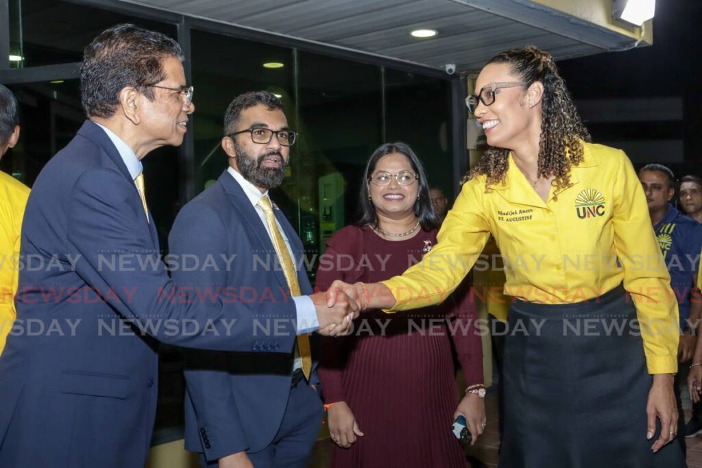 MP for St Augustine Khadijah Ameen greets former Naparima College principal Michael Dowlath, who has been selected as the UNC's prospective candidate for San Fernando West in the next general election, as San Juan/Barataria MP Saddam Hosein and Chaguanas East MP Vandana Mohit look on at the party's headquarters in Chaguanas on November 29. - Photo by Grevic Alvarado