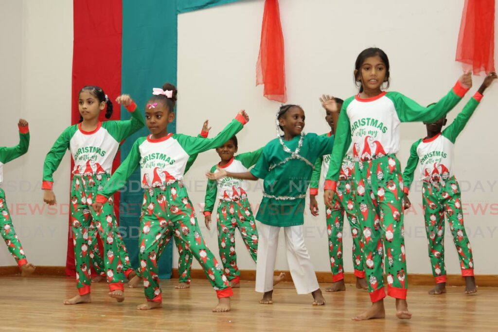 Standard 1 pupils of Escallier/St Jerome's Anglican Primary School perform at their Christmas Concert at Belmont Community Centre, Jerningham Avenue, Belmont, on December 3. They danced to Rocking Around the Christmas Tree. - Faith Ayoung