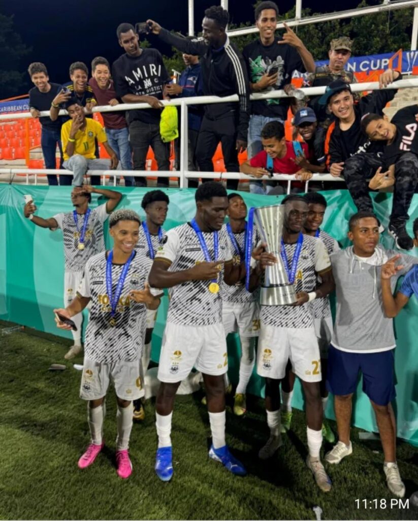 Kaile Auvray, front row left, celebrates with Cavalier FC teammates and fans after the Jamaica Premier League club won the Concacaf Caribbean Cup on December 3. - Photo courtesy Cavalier FC's Facebook Page