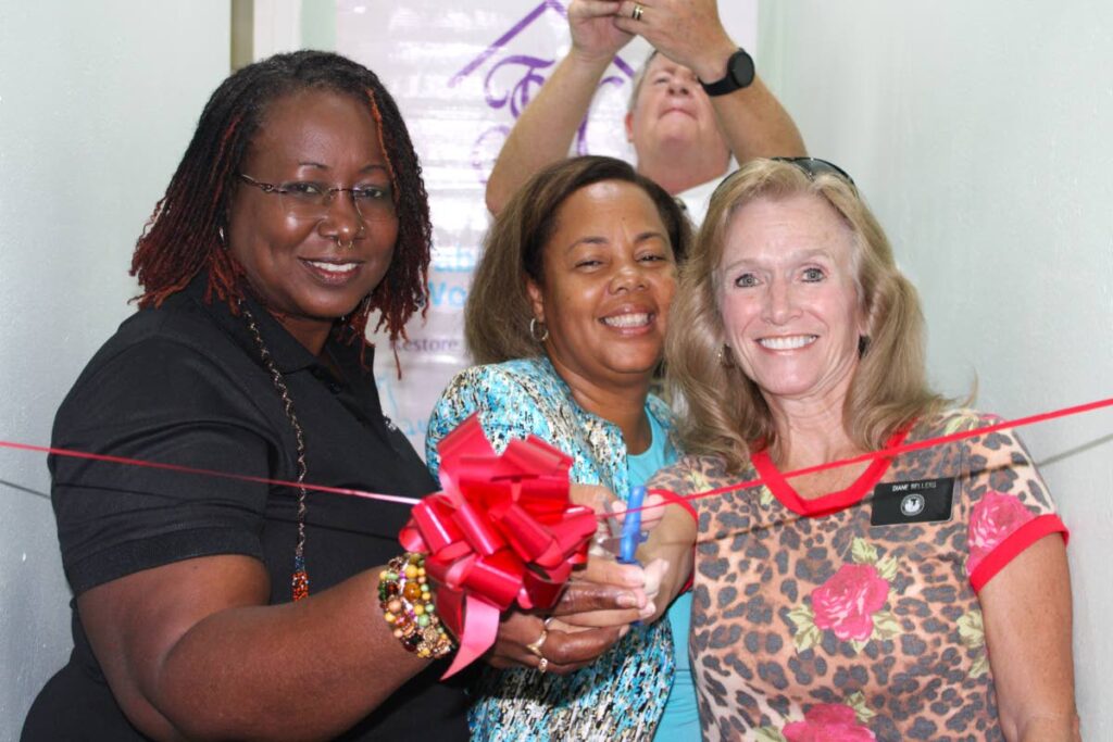 From left, Georgina Peterkin, Digicel Foundation director; Rowena Martineau-Pitt, president of Tabitha’s Home for Women and Children, and Diane Sellers, humanitarian missionary for The Church of Jesus Christ Latter-day Saint Charities, cut the ribbon on the new self-contained apartment units at Tabitha’s Home for Women and Children in Tobago on November 22. -