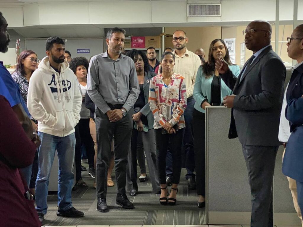 WASA CEO Keithroy Halliday, right, speaking to WASA staff as he visited facilities on December 3. -