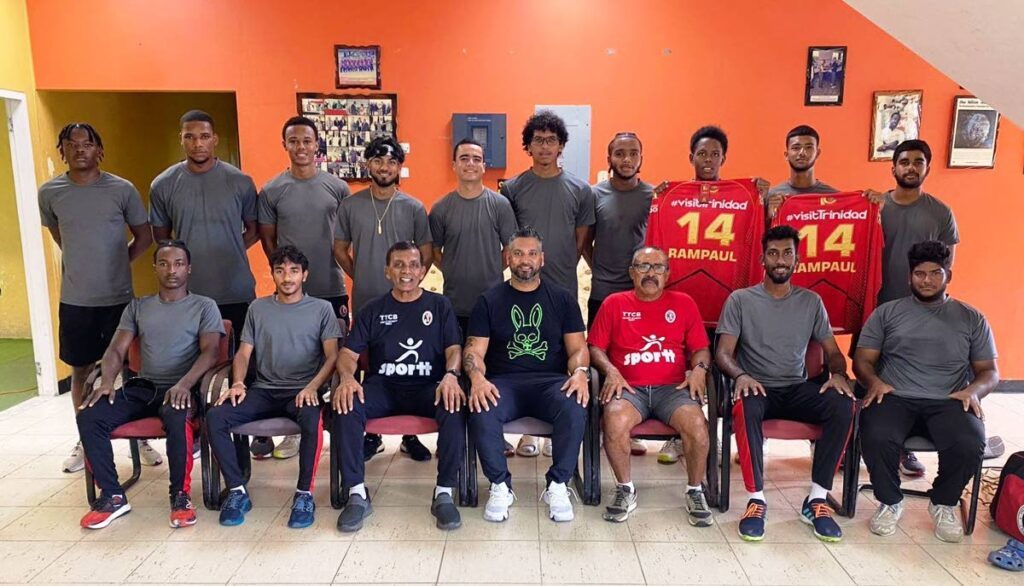 TT Cricket Board Academy graduates along with coaches at the National Cricket Centre in Couva. Joining the players are coach Debideen Manick, third from left sitting, former West Indies and TT cricketer Ravi Rampaul, middle sitting, and coach Gerald Garcia, third from right sitting. - COURTESY TT CRICKET BOARD