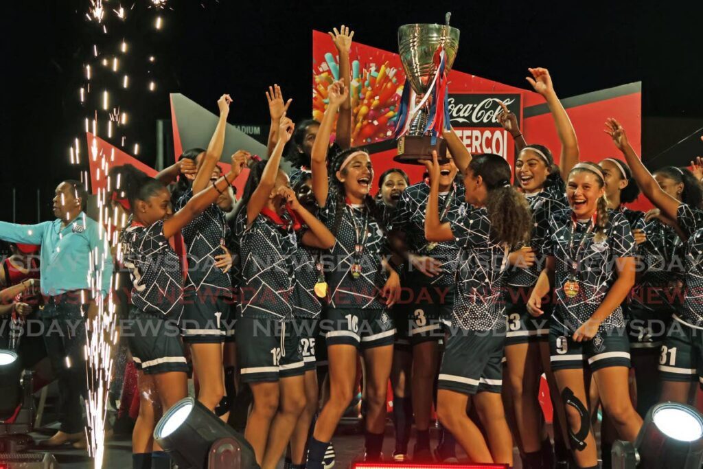 CHAMPS: St Joseph’s Convent Port of Spain celebrate after beating Pleasantvile Secondary during the final of the Secondary Schools Football League Coca-Cola national girls’ intercol final, on December 5. - Photo by Lincoln Holder