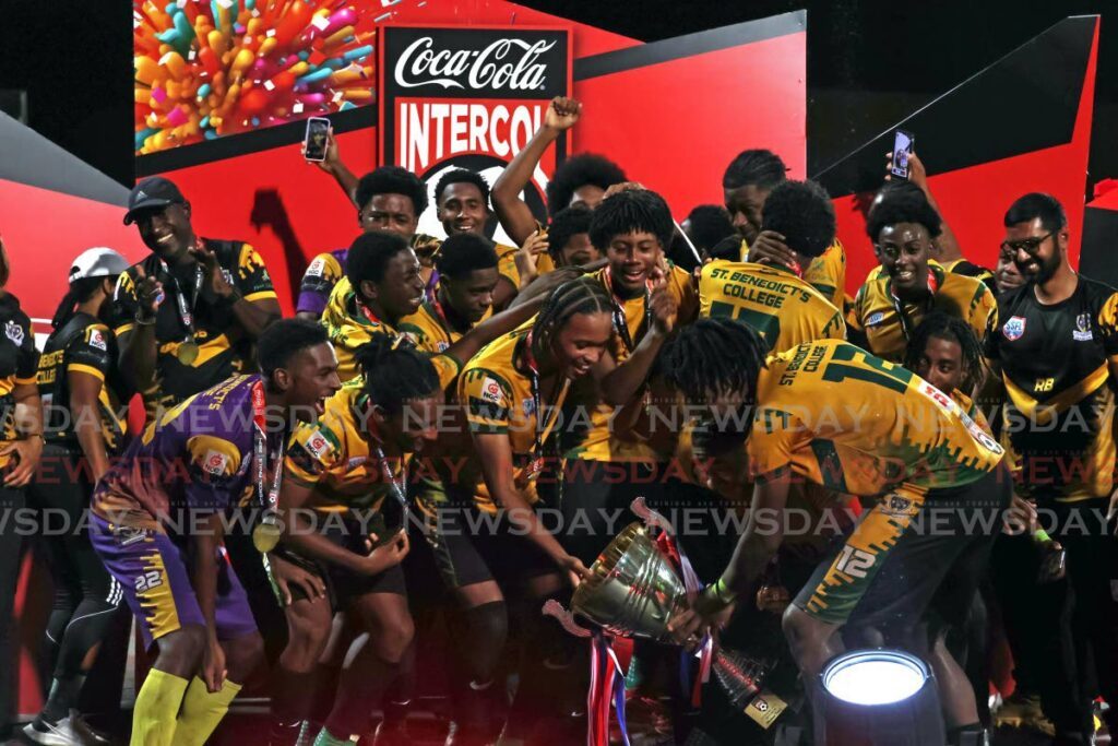 St Benedict's College players and officials celebrate after beating Fatima College 2-0, in the Coca-Cola national inercol final, on December 5, 2024 at the Ato Boldon Stadium, Couva.  - lincoln Holder