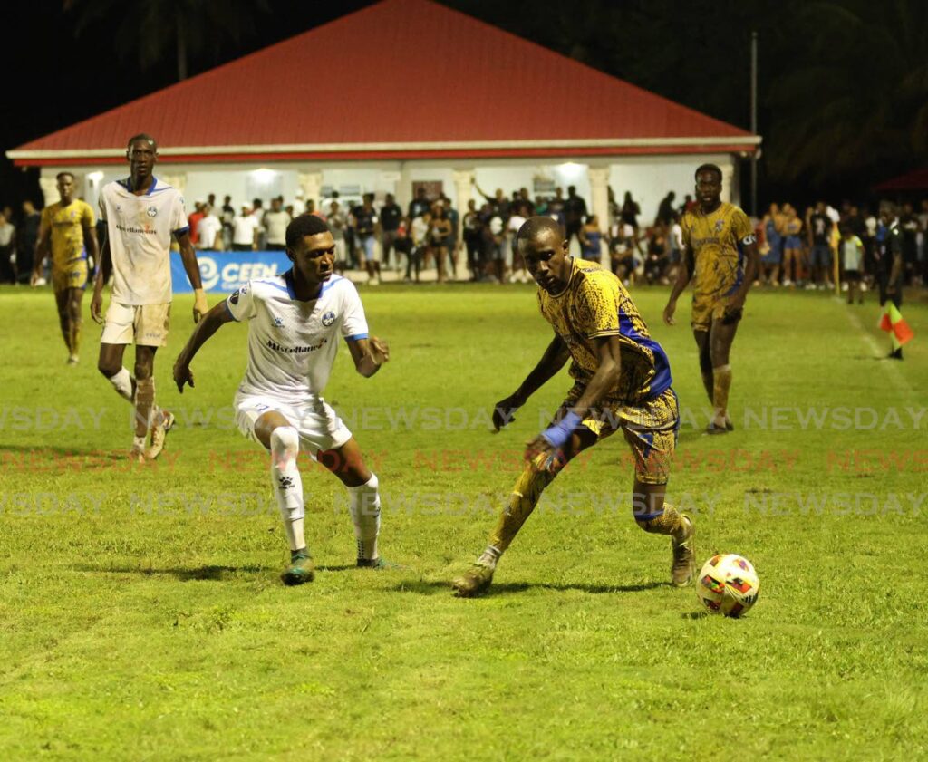 Kidane Lewis of Police FC tries to close down Defence Force player Jelani Felix in the TTPFL opener at La Horquetta Recreation Grounds, on December 6.  - Faith Ayoung