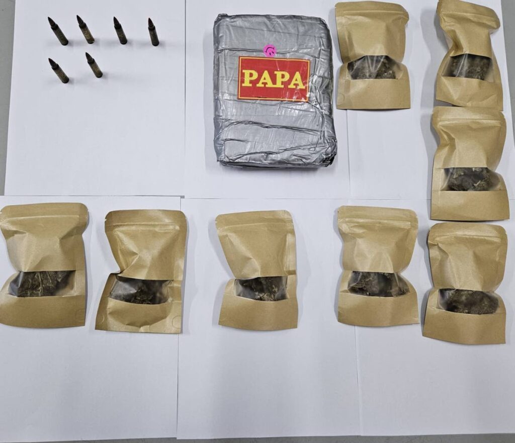 Packets of marijuana and ammunition seized by police during operations in the Port of Spain district on December 6. - Photo courtesy TTPS