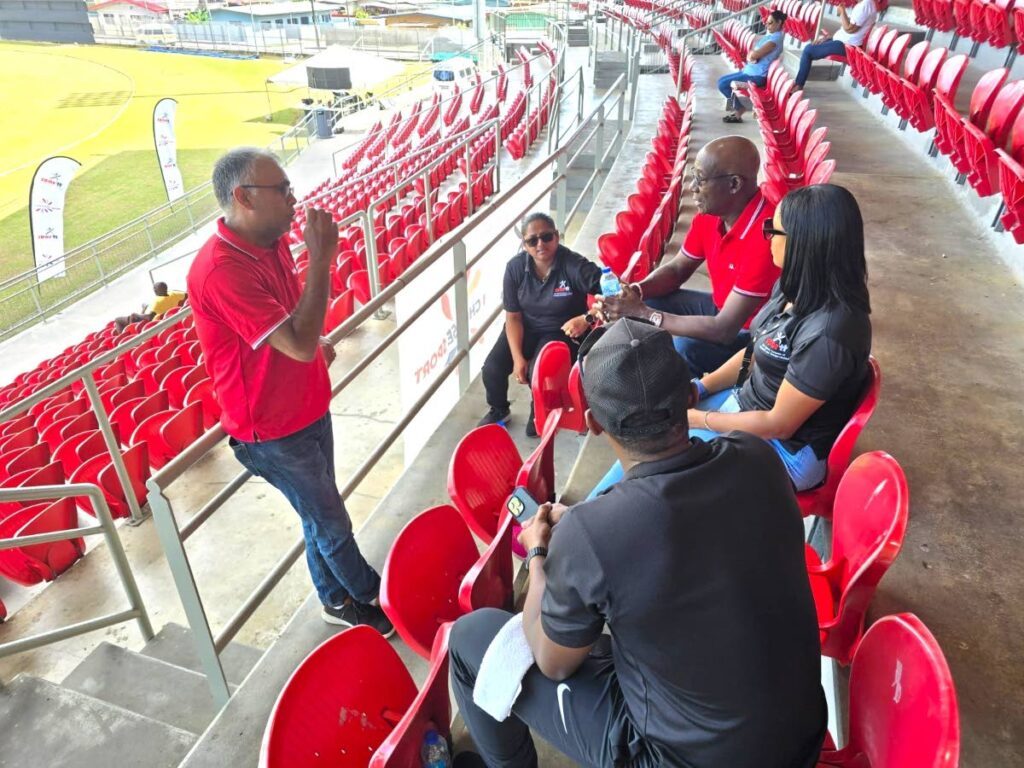 The Prime Minister, second from right, chats with, from left, Jason Williams, CEO of the Sports Company of TT; former West Indies Women’s T20 World Cup winner Anisa Mohammed; former TT Red Force all-rounder Navin Stewart and; Merissa Aguilleira, former West Indies Women's captain. - COURTESY SPORTT