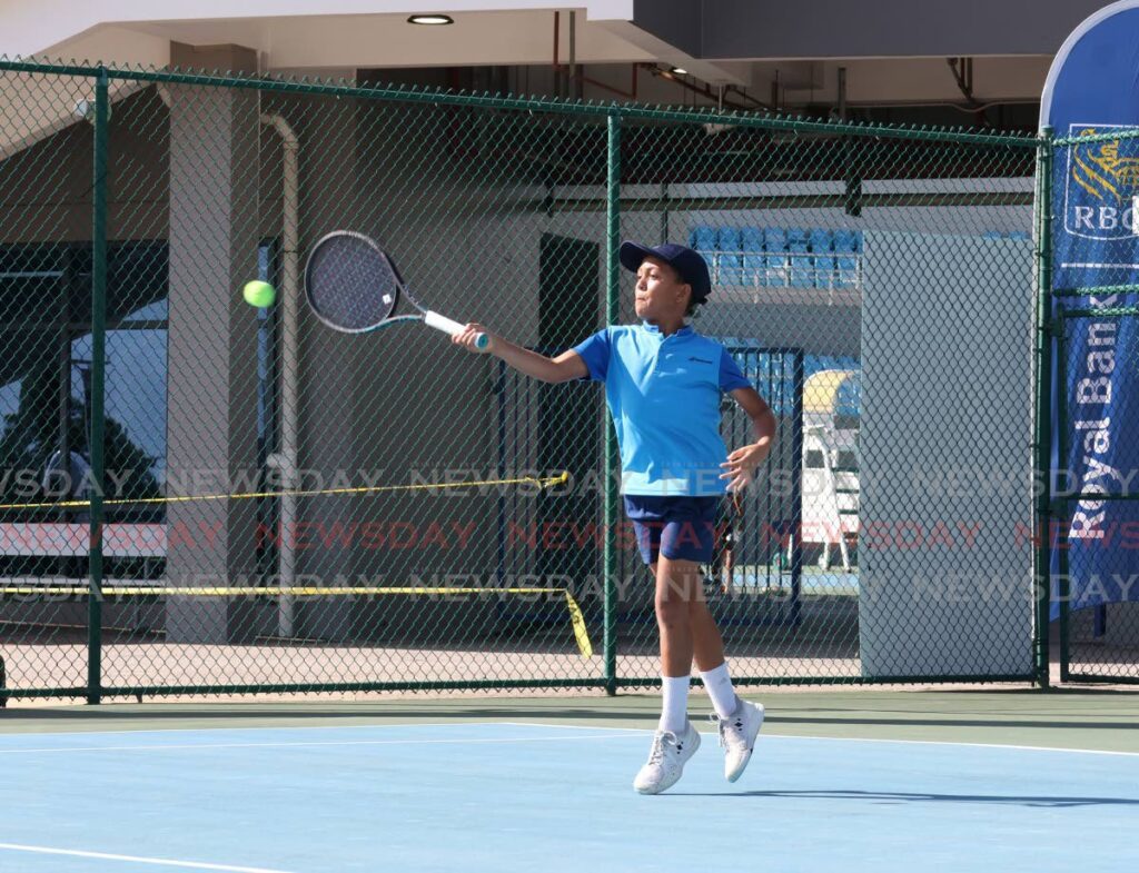 Brabados’ Cruz Thorton plays against TT’s Paul Devaux in the Boys’ Under-12 singles qualifiers at the RBC Jr Tennis Tournament at the National Racquet Centre, Tacarigua on December 9. - Faith Ayoung