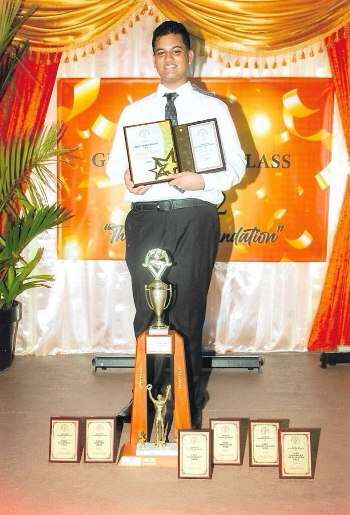 Open scholarship winner Sharad Hatai with his awards at his graduation from Vishnu Boys’ Hindu College. - 