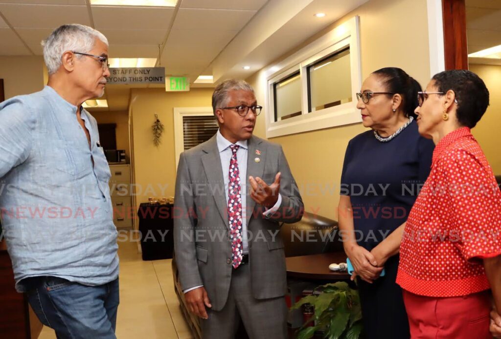 Attorney General Reginald Armour, centre, speaks with attorney Douglas Mendes SC, from left, LATT president Lynette Seebran-Suite SC, and moderator Roberta Clarke during the CADV and CAFRA TT seminar Centering Women in the State's Duty to Protect at the Law Association of Trinidad and Tobago building, Frederick Street, Port of Spain, on December 9. - Photo by Ayanna Kinsale