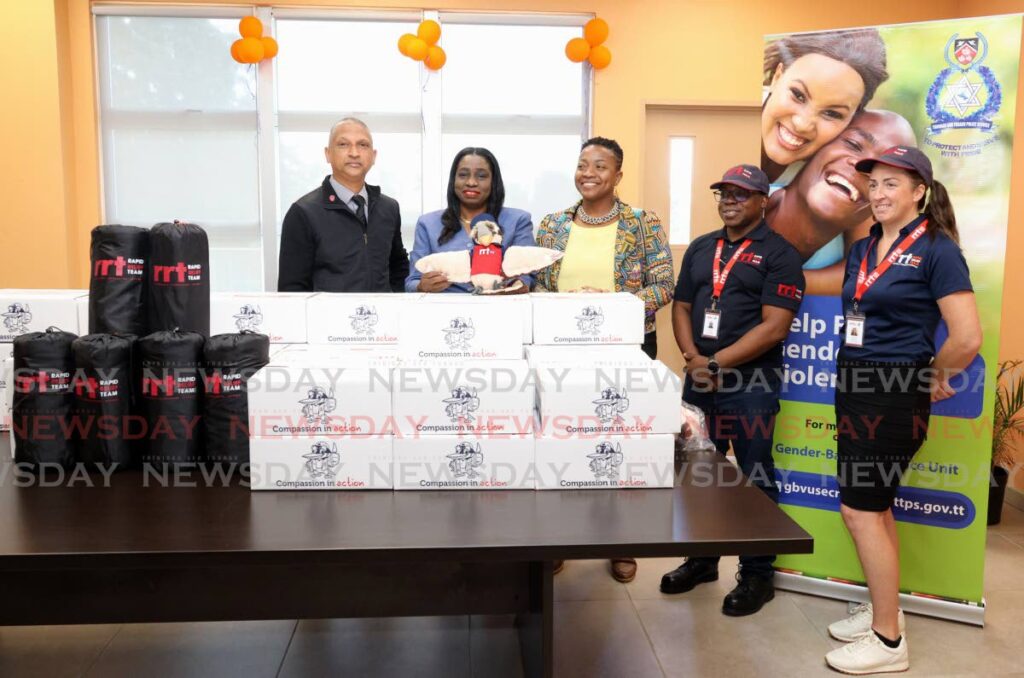 From left, Asst Supt Seecharan, Special Victims Department head Supt Michelle Rowley-Powder, Operation Victims Support Unit supervisor Janelle Sebastien Reyes, and members of the Rapid Relief Team Philip Mings and Ellain Emtage at the showcasing of food hampers for domestic violence victims at St Clair Police Station, on December 12. - Faith Ayoung