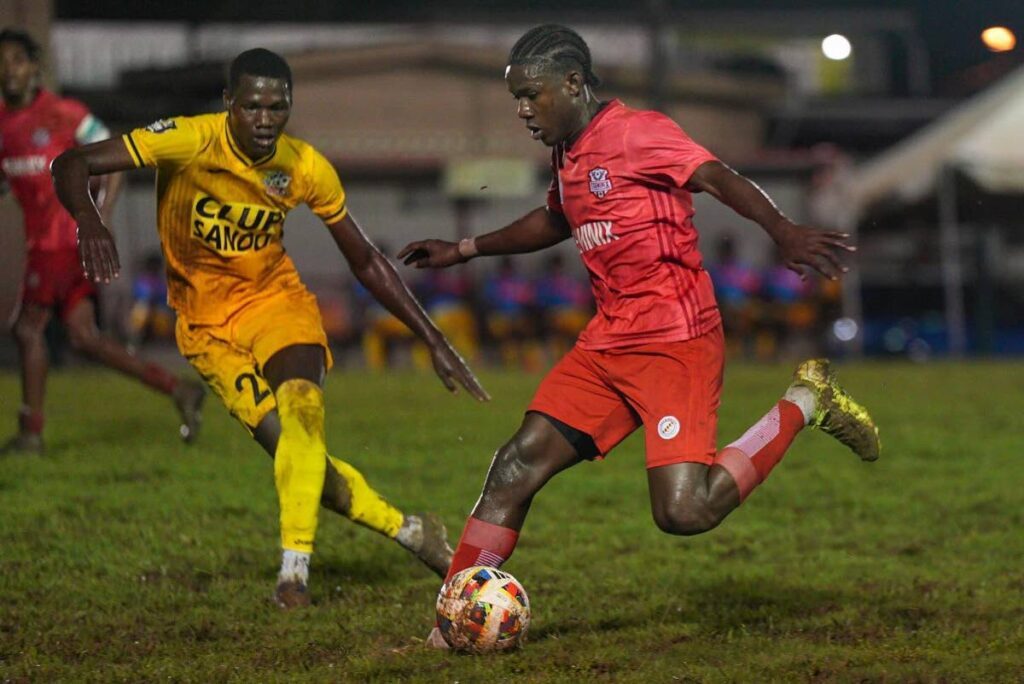 La Horquetta Rangers' Malachi Celestine, right, is marked by his Club Sando rival in a TTPFL game in La Horquetta on December 13.  - TTPFL