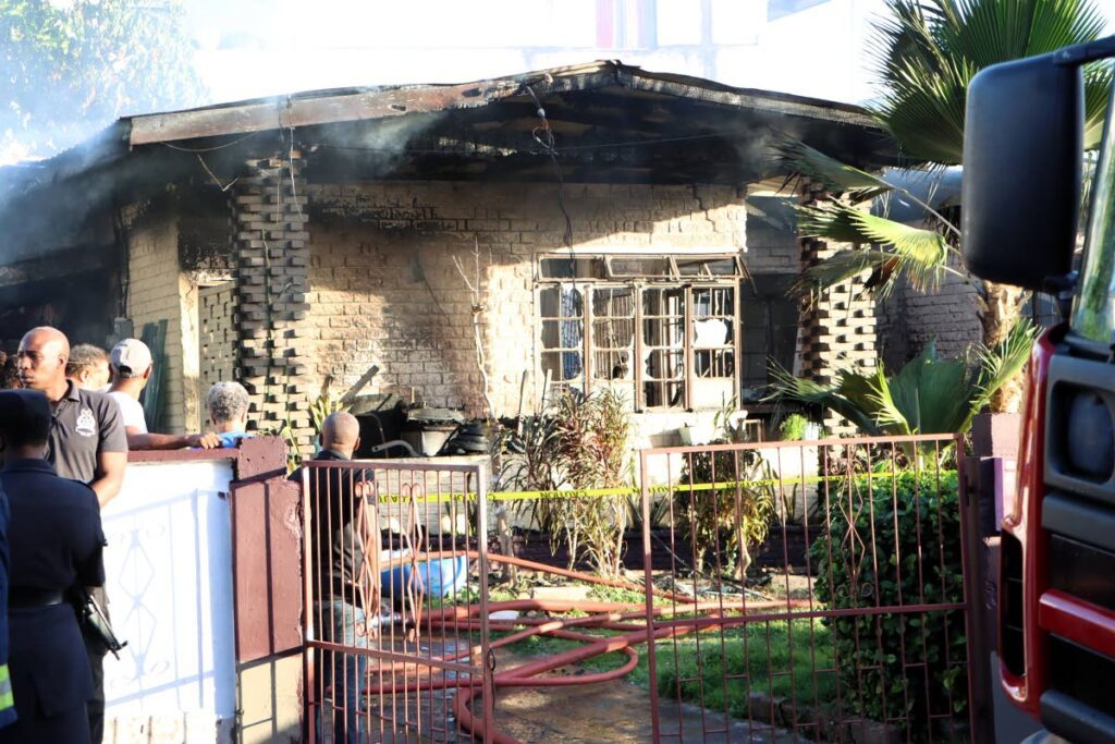 The gutted Farfan Street, Arima, home of MP Lisa Morris-Julian. 
Morris-Julian and two of her children, Xianne and Jesiah, died in the early morning blaze on Monday.  - Photo by Angelo Marcelle