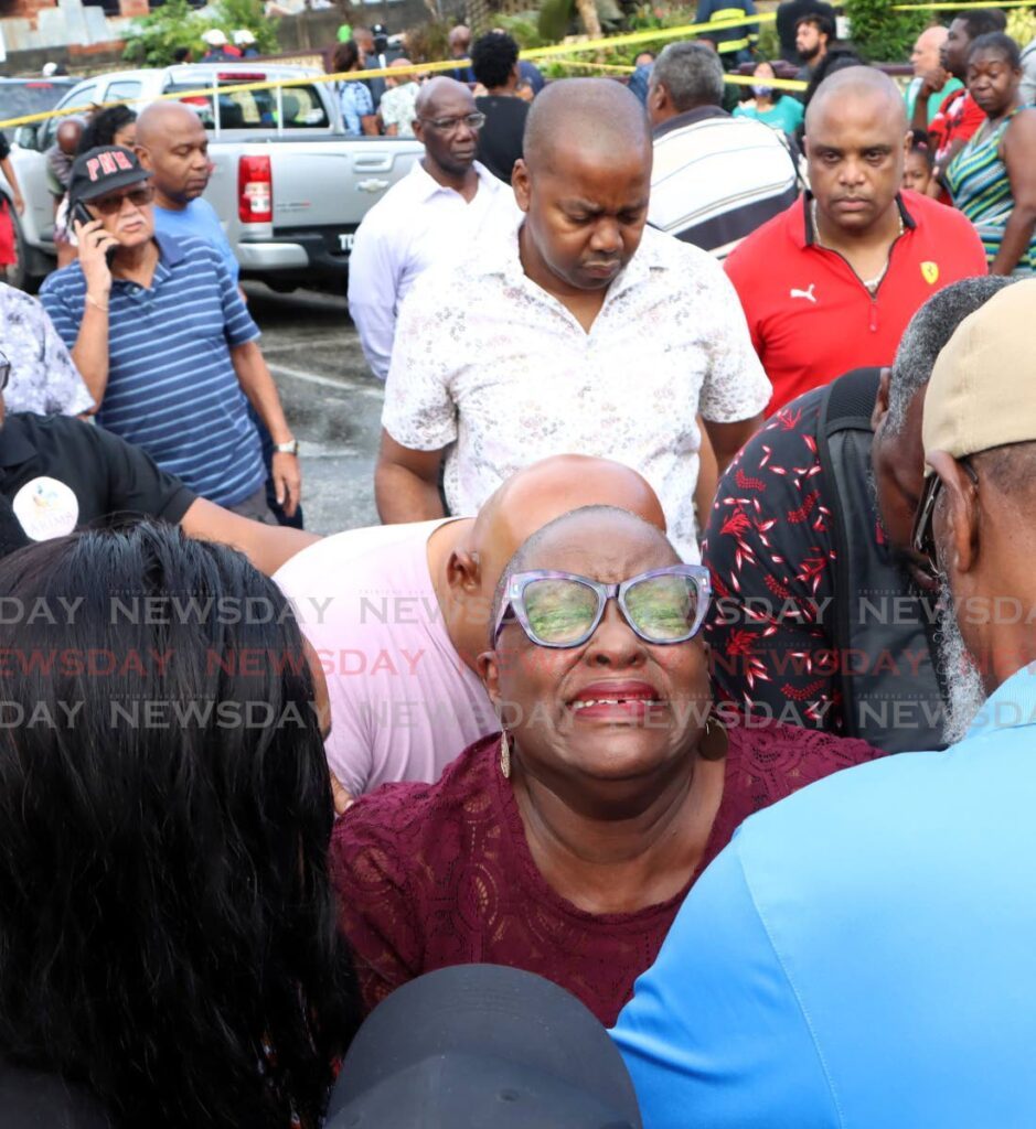 Minister of Housing Camille Robinson-Regis was visibly distraught after learning her colleague, Minister in the Ministry of Education Lisa Morris-Julian, and  two of her children had died in a fire that gutted their Farfan Street, Arima home on Monday morning.  - Photo by Angelo Marcelle