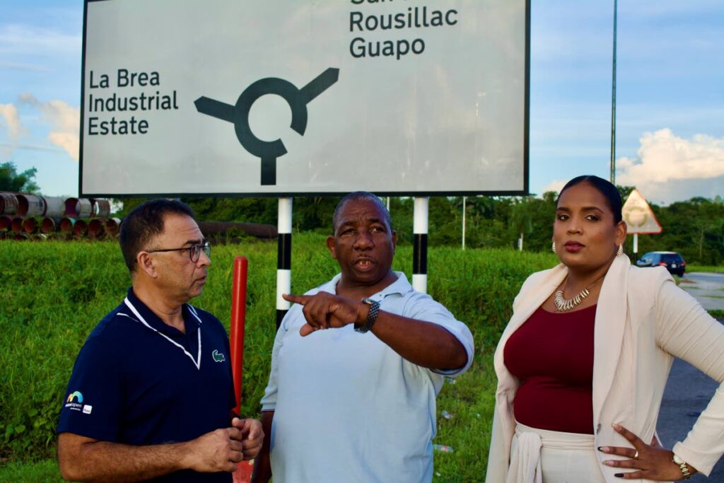 Point Fortin Taxi Drivers’ Association president John David makes a point at the proposed new location for the CNG station in La Brea to NGC Green’s Roger Sant communications manager, left, and Anna-Alisa Goindoo, sales and marketing manager.  - Photo courtesy NGC