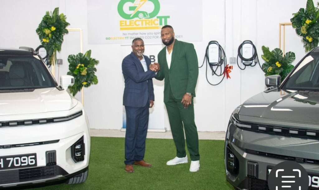 Ex-West Indies cricketers Dinanath Ramnarine, left and Kieron Pollard at the launch of the GoElectric TT on December 7.  - 