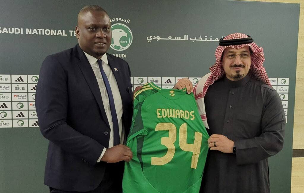 TTFA president Kieron Edwards (L) receives a customised jersey from Saudi Arabia Football Federation president Yasser Al Misehal at a MoU signing between the two associations in Riyadh, Saudi Arabia on December 18. (TTFA Media) - 