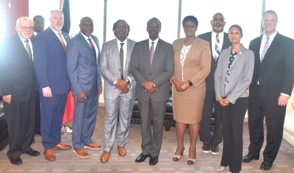 Minister of National Security Fitzgerald Hinds, centre, Minister in the Ministry of National Security Keith Scotland, centre-left, Commissioner of Police Erla Harewood-Christopher, centre-right, and other officials attended a meeting with US law enforcement experts, held at the Ministry of National Security, on December 17. - 