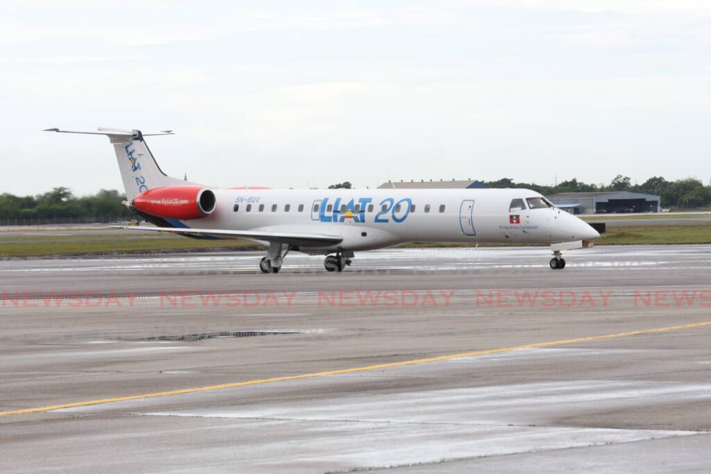 The Liat20 aircraft lands on the runway for the inaugural flight welcome reception at the international departure lounge at the Piarco International Airport, Piarco on December 19. - Photo by Faith Ayoung