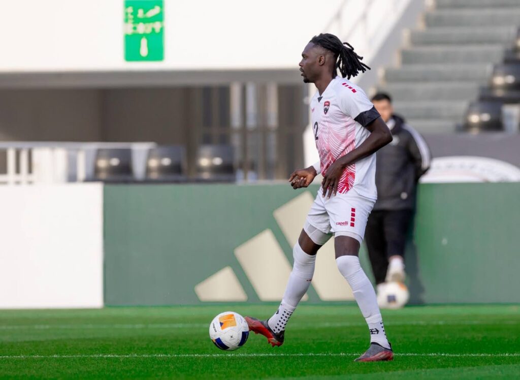 Soca Warriors captain Aubrey David looks for a passing option versus Saudi Arabia in a friendly international at the Al Shabab Club Stadim in Riyadh, Saudi Arabia on December 17.  - 