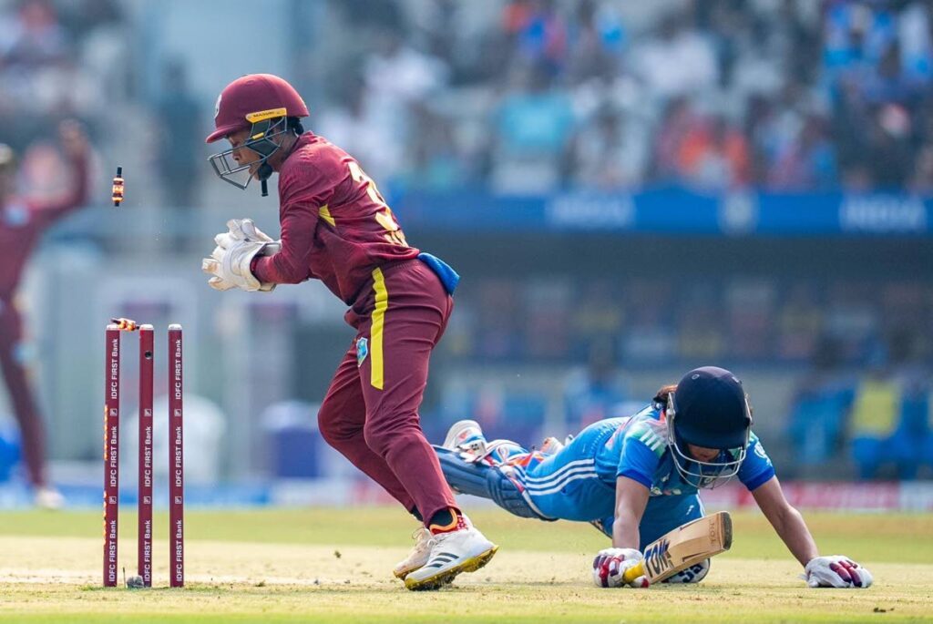 West Indies women's wicketkeeper Shemaine Campbelle runs out India captain Harmanpreet Kaur during the first One-Day International on December 22 at the Kotambi Stadium, Vadodara, India. PHOTOS COURTESY BOARD OF CONTROL FOR CRICKET IN INDIA  - 