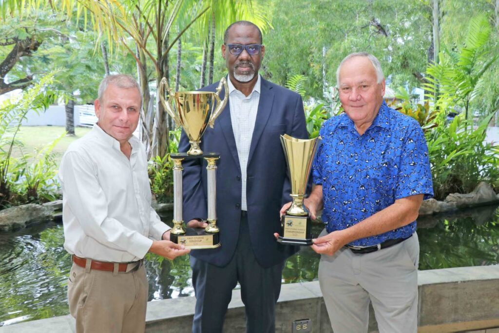 Arima Race Club member Roger Hadeed, from left, general manager Trustee Services, First Citizens and management committee member of the Arima Race Club  John O’Brien show the Boxing Day trophies for the First Citizens Gold Cup and First Citizens
Juvenile Championship. PHOTO COURTESY FIRST CITIZENS - 