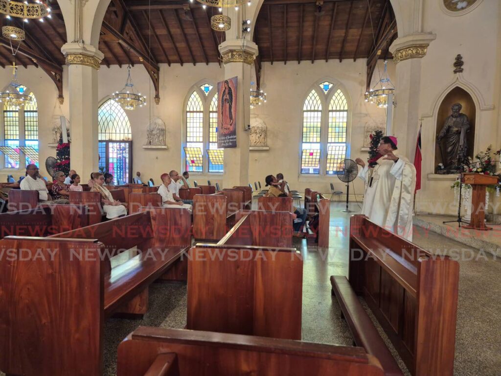 Archbishop Jason Gordon preaches to congregants at the Cathedral of the Immaculate Conception, Port of Spain, on Christmas Day. - Photo by Paula Lindo