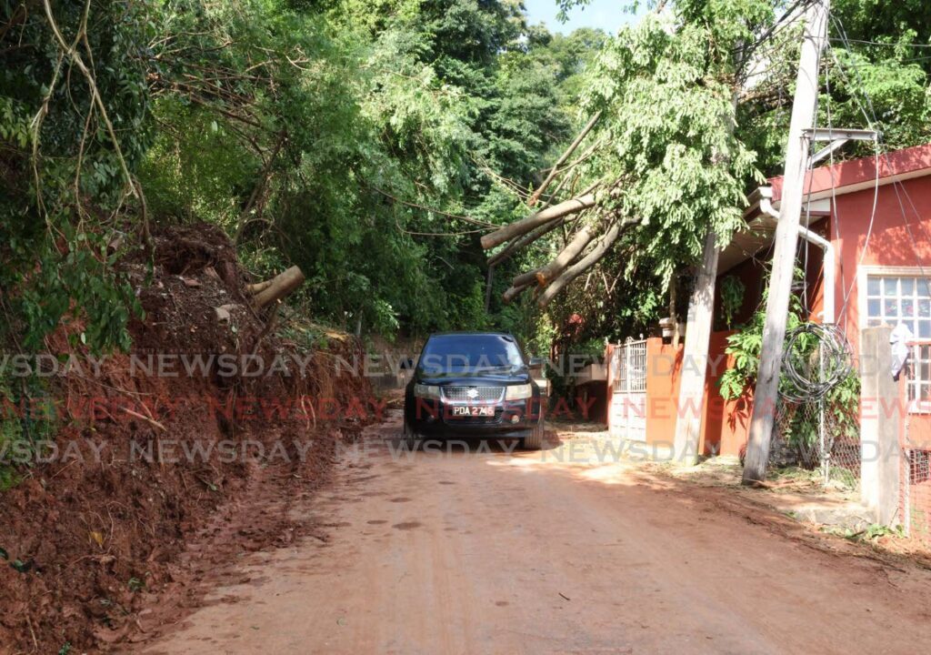 CLEARED OVERNIGHT: Workers at the Diego Martin Borough Corporation worked overnight on Christmas Day to clear a landside at Fort George, St James. - Faith Ayoung