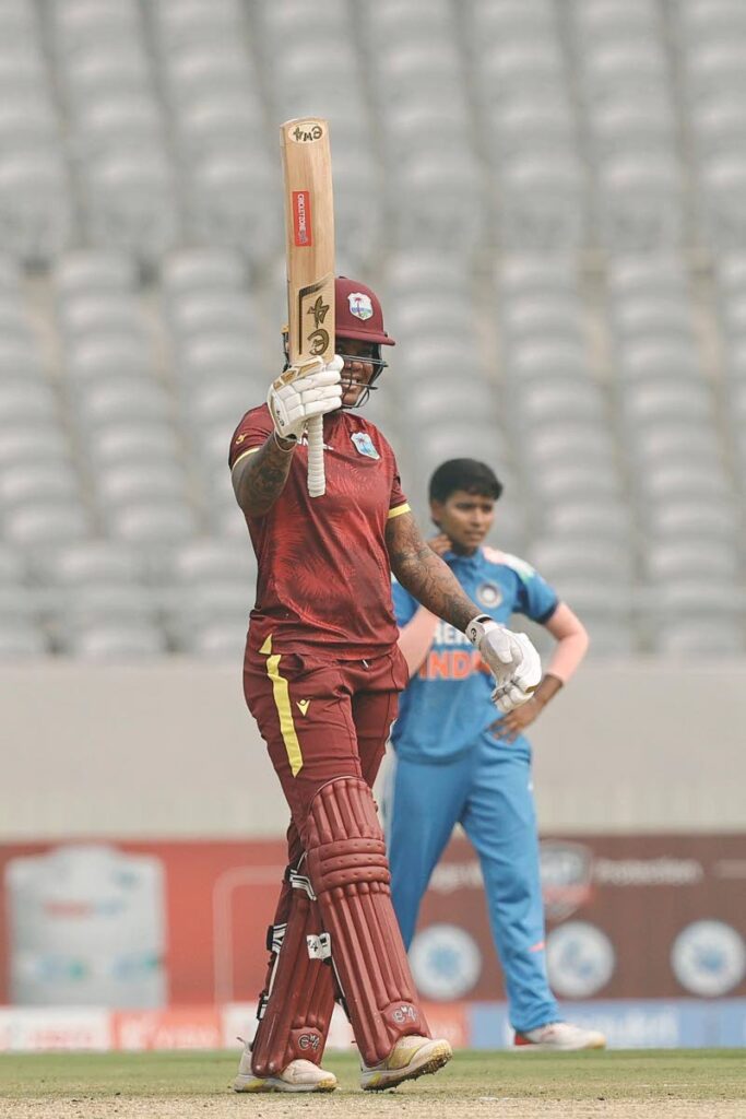 West Indies women's team allrounder Chinelle Henry raises her bat after getting to 50 in the third One-Day International against India at the Kotambi International Cricket Stadium, Vadodara on December 27, 2024. - Photo courtesy BCCI