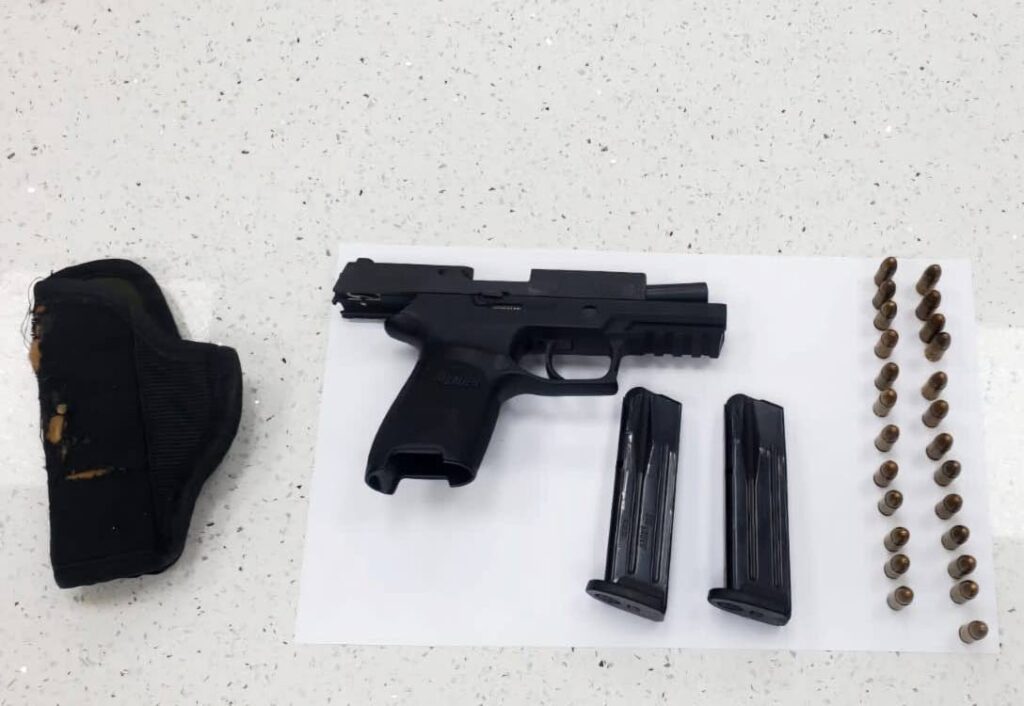 The gun and ammunition seized by police on December 27 in Arima. - Photo courtesy TTPS