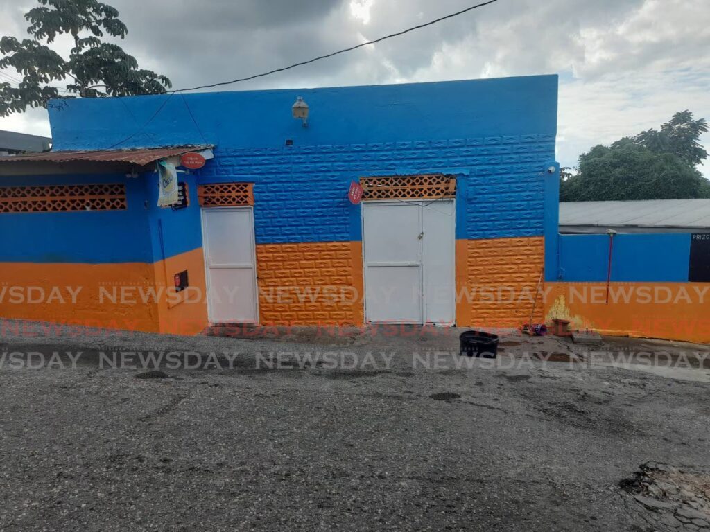 Shut up shop: A shop in Prizgar Lands, Laventille is closed for business on December 30, hours after a shooting incident claimed the lives of five men on the night of December 29.  - Photo by Roneil Walcott