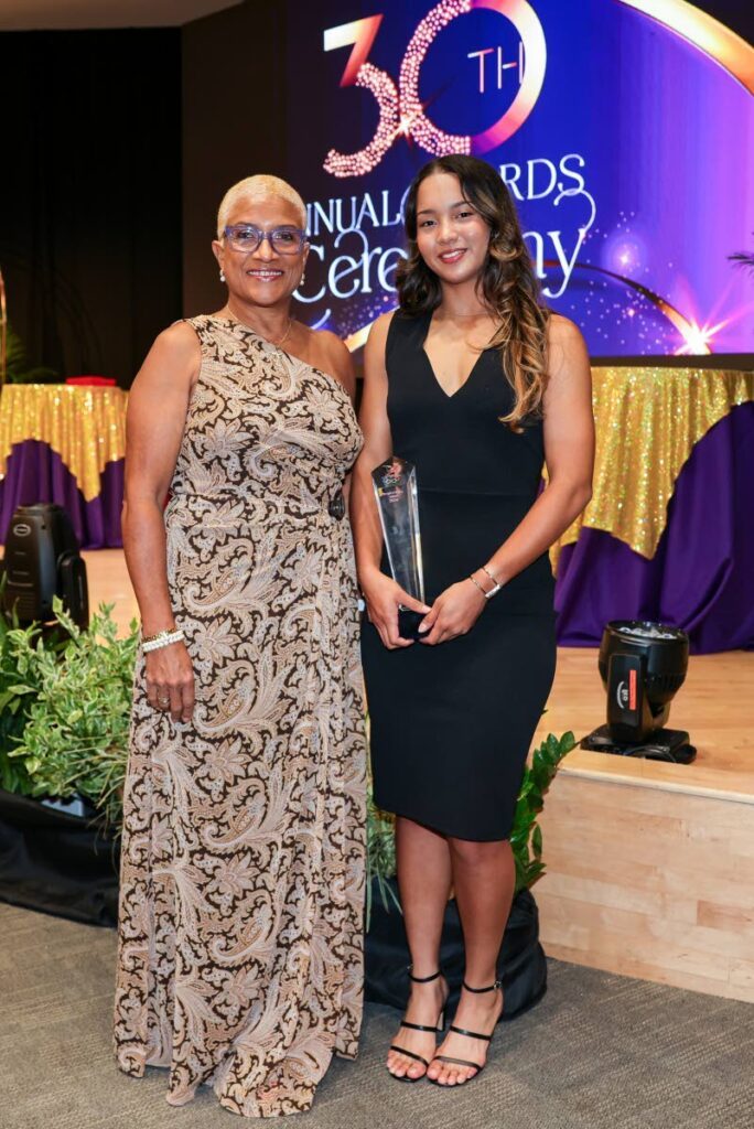 Trinidad and Tobago Olympic Committtee (TTOC) president Dianne Henderson (L) and the TTOC’s 2024 People’s Choice Award recipient junior cyclist Makaira Wallace attend the TTOC’s annual awards ceremony, on December 29, at the Government Campus Plaza Auditorium, Port of Spain.  - Photo by Daniel Prentice